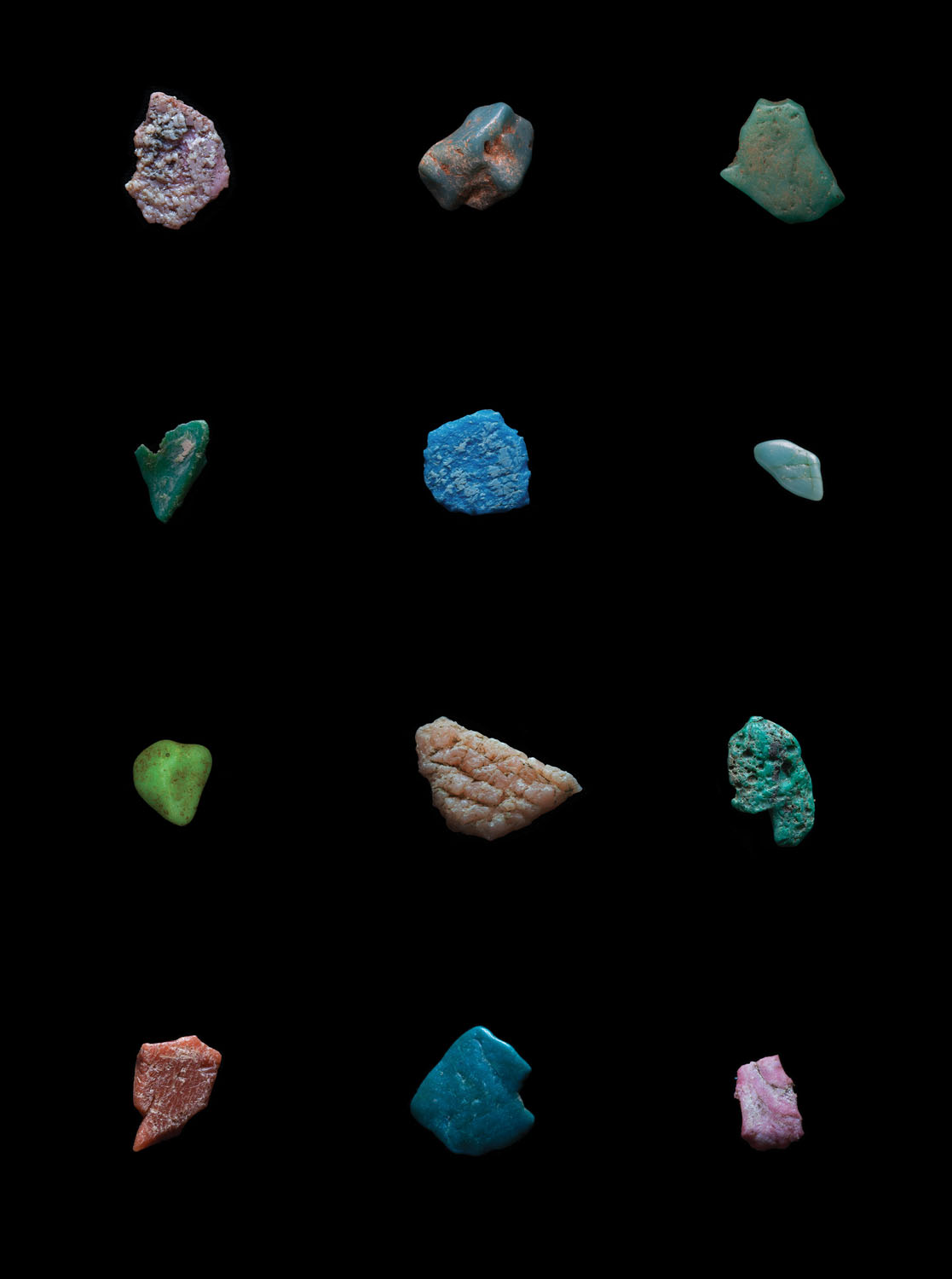 Photo of colorful stones organized in a grid by Mandy Barker.