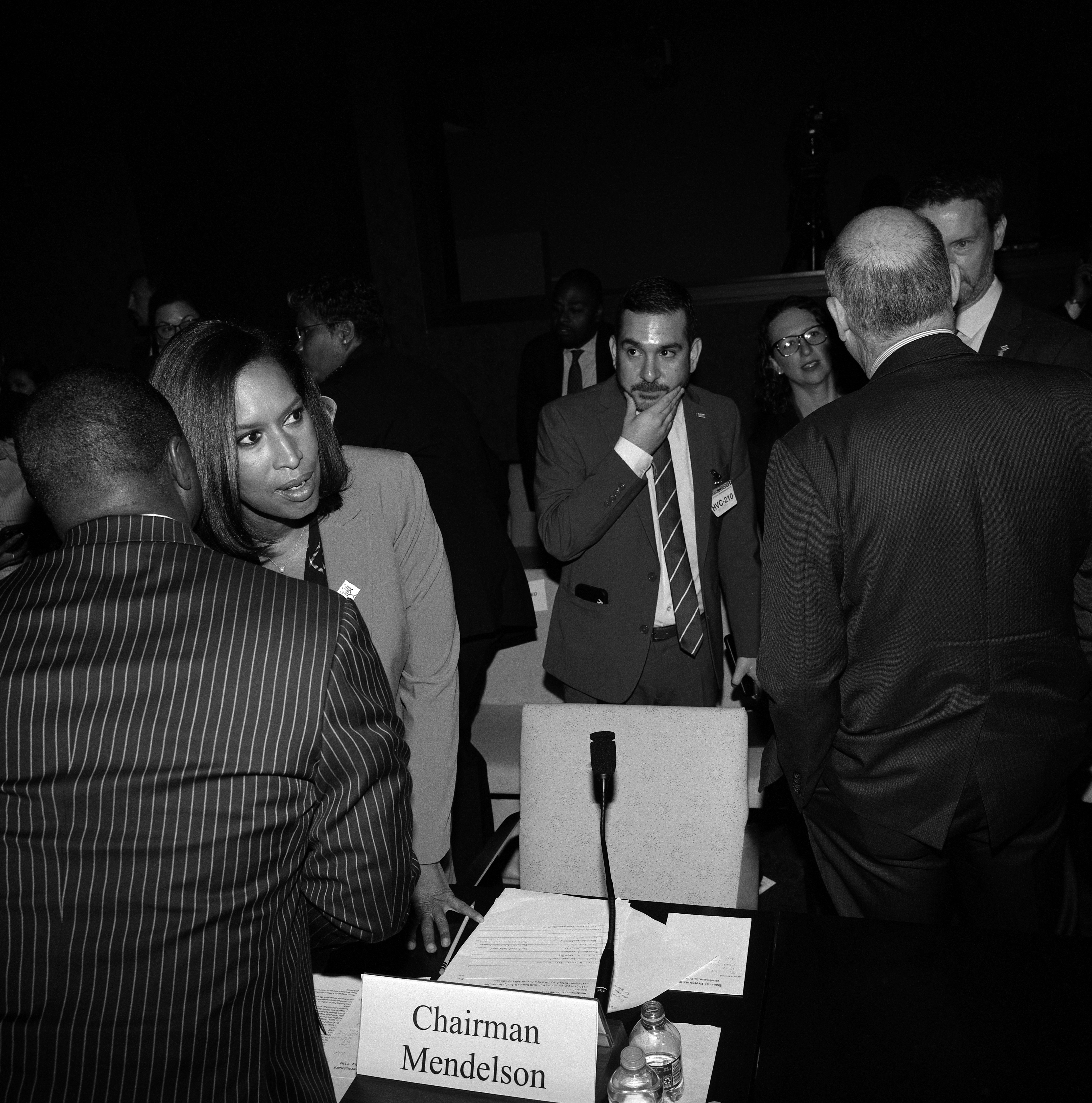 Washington, DC, Mayor Muriel Bowser whispering.