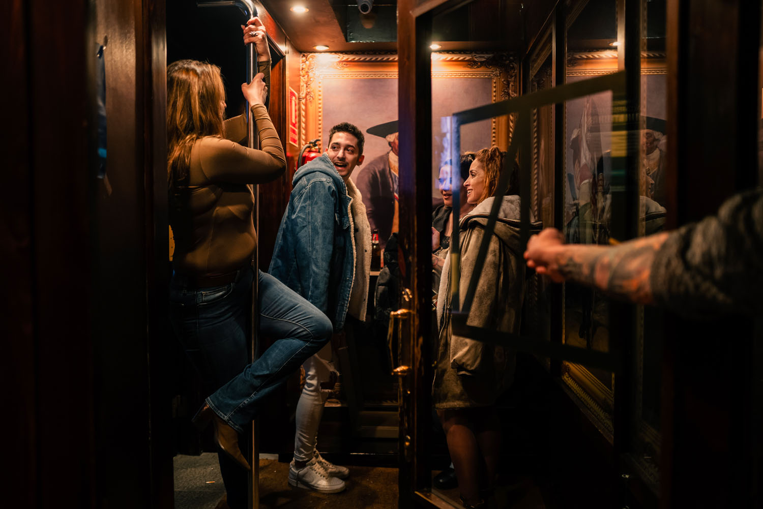 Young adults hanging in the foyer of a nightclub