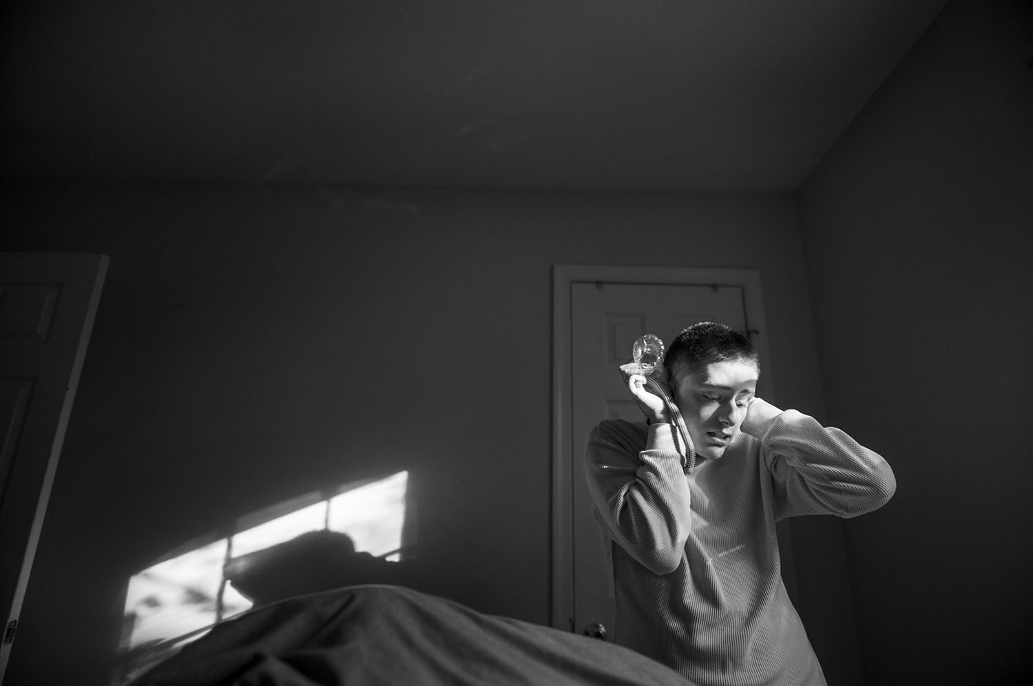 Boy covers ears with hands. 