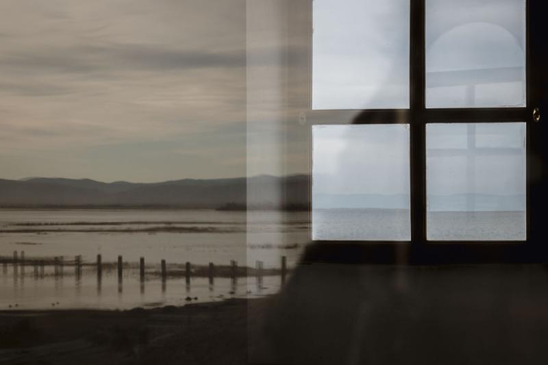 Reflection of windowpanes in front of lake