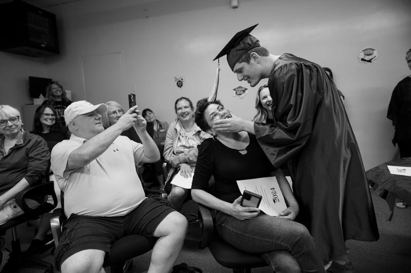 Boy in graduation cap and gown.