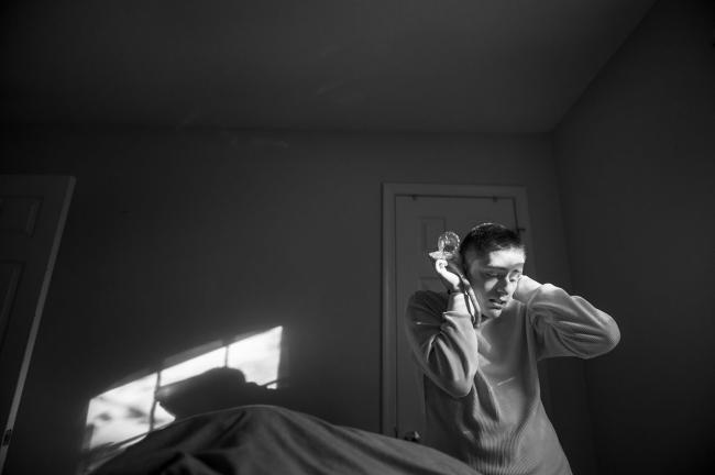 Boy covers ears with hands. 